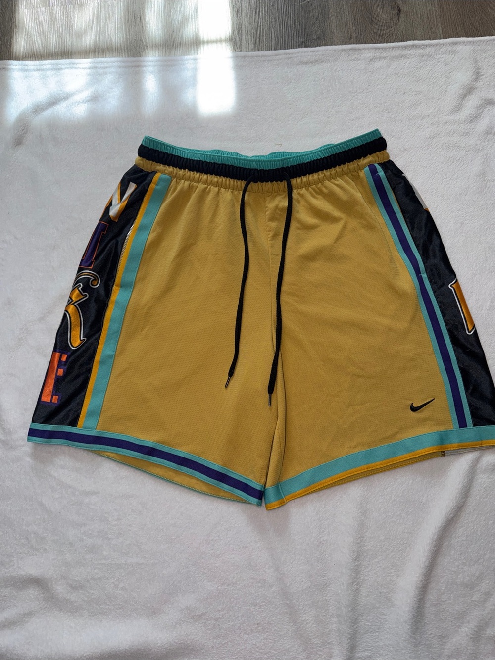 Nike Men’s Yellow Athletic Shorts with Teal and Black Accents